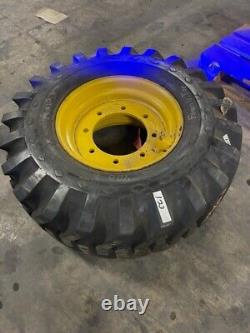 Goodyear Super Sure Grip 14x17.5 Foam Filled on 6 bolt yellow wheel Each