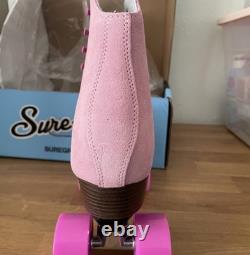 Patins à roulettes Sure Grip roses, taille 8, neufs dans leur boîte 

	<br/> 